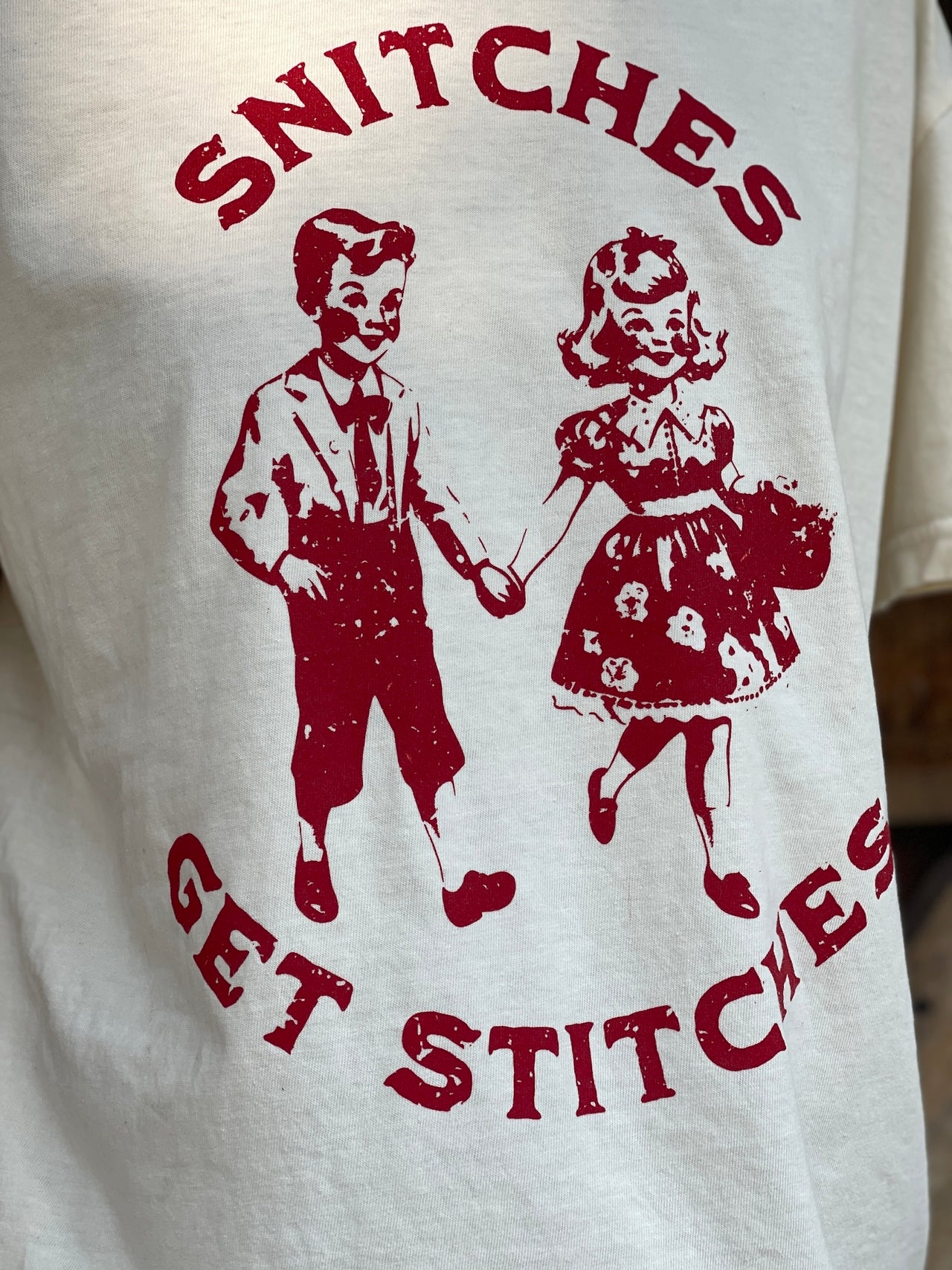 Snitches Get Stitches Tee- Ivory